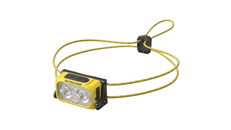 A yellow headlamp with adjustable strap