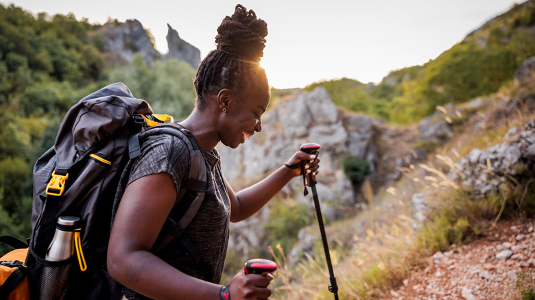Woman laughing while hiking