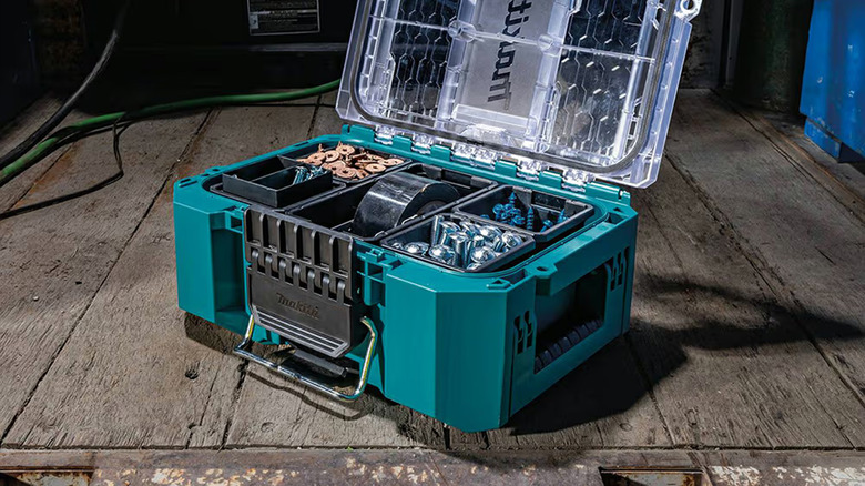 A Makita organizer on the back of a box truck.