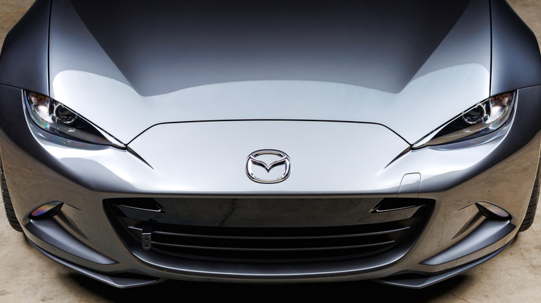 Top-down view of the front of a gray Mazda Miata RF, showing Mazda logo