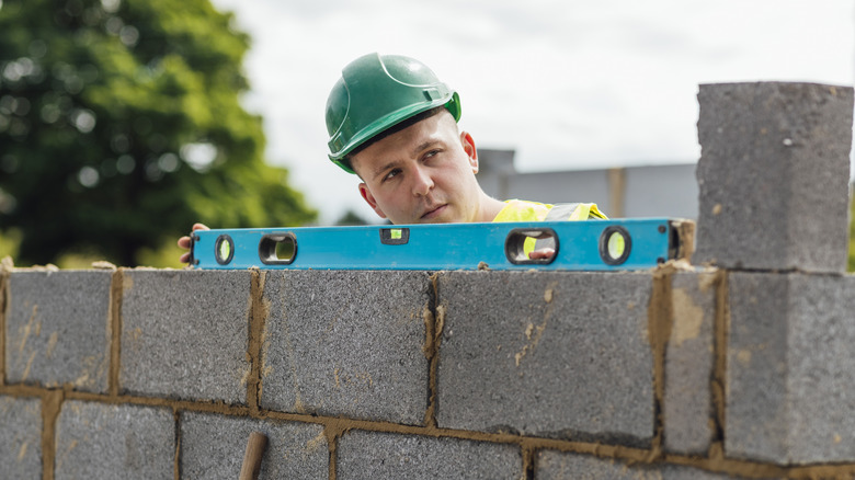 a level sitting on a wall being built