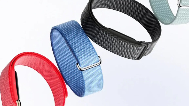 four different colored fitbit airs