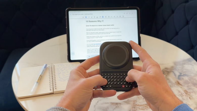Person using the clicks power keyboard paired to a tablet