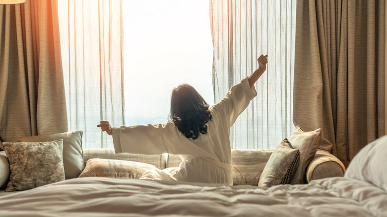 Woman waking up and stretching