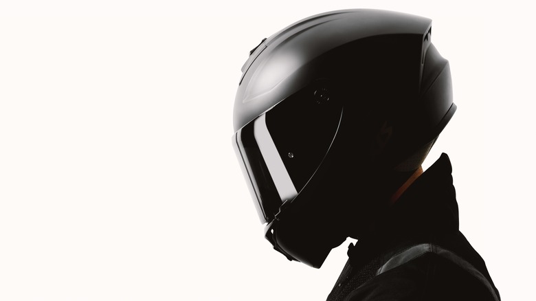 A motorcyclist with a helmet on