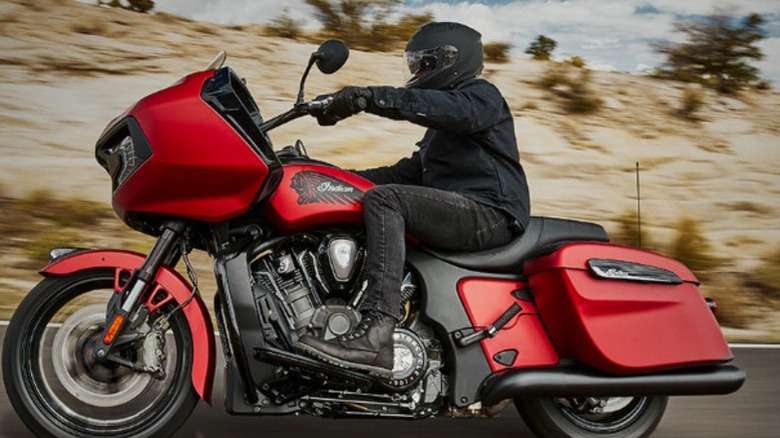 Man riding red Indian motorcycle