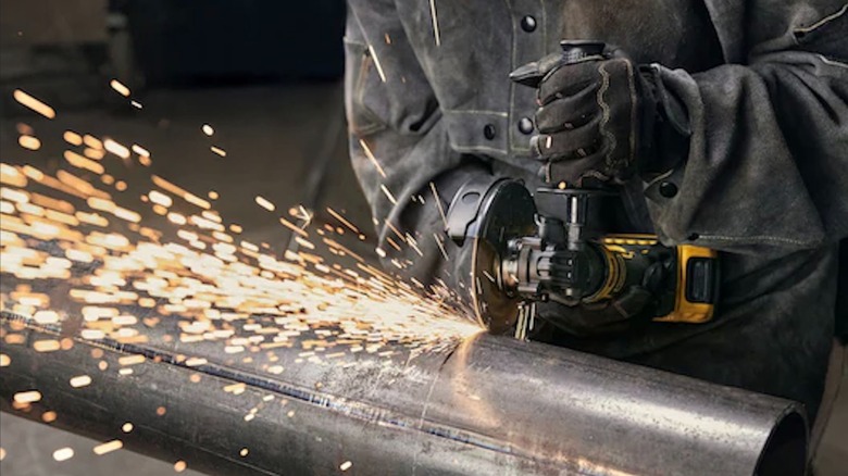 DeWalt Atomic 20V Max Cordless 4 ½-inch Angle Grinder with Paddle Switch in use