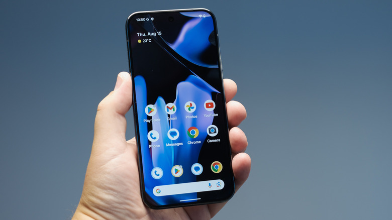 A person holding and using a Pixel smartphone