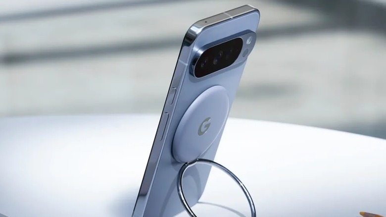 A Pixel 10 Pro smartphone with an accessory attached via PixelSnap