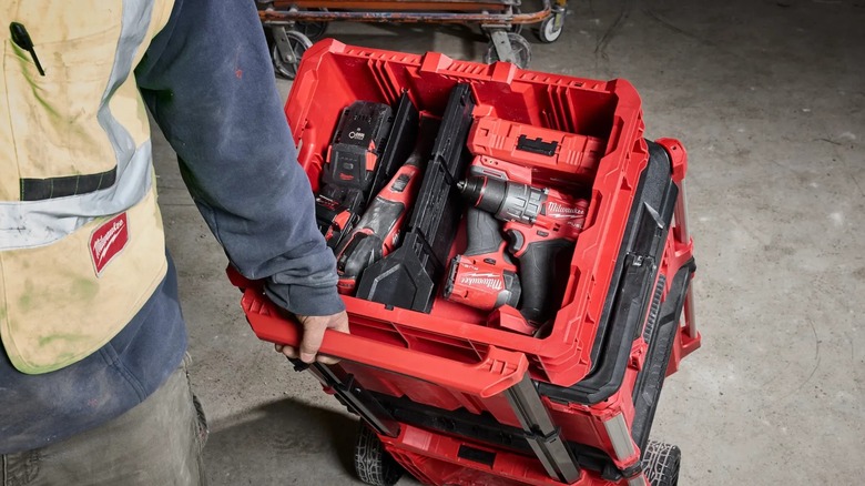 A person pulling their Milwaukee Packout stack.