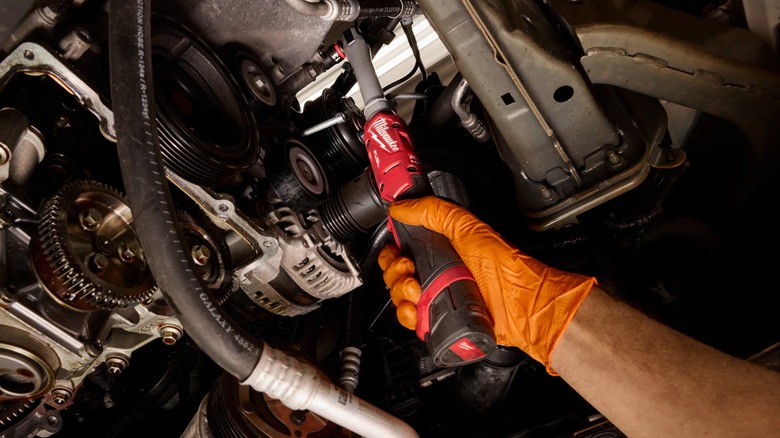 Milwaukee M12 Fuel ⅜-inch Extended Reach Ratchet in use