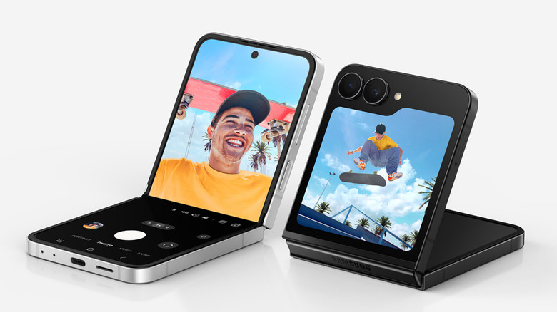Two Samsung Galaxy Z Flip7 FE smartphones, both of them in a half-folded state on a white background