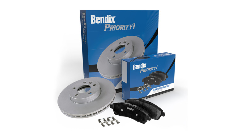 A set of Bendix brake pads with a brake rotor