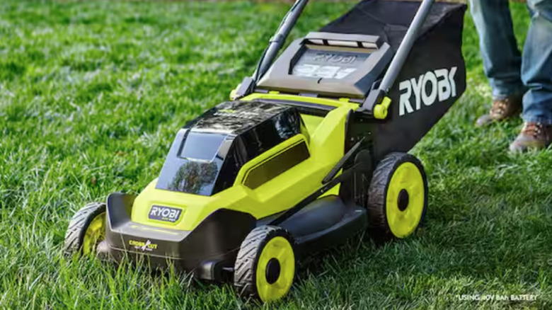 Ryobi electric mower doing yard work