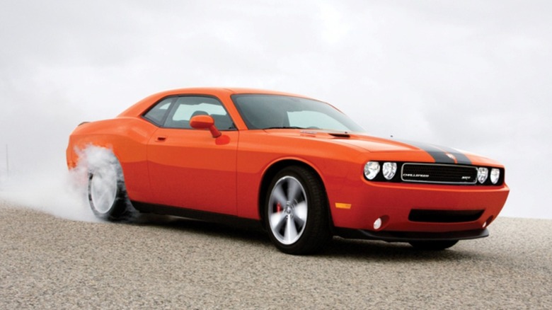 Third-generation Dodge Challenger smoking its tires.