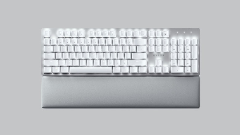 The Razer Pro Type Ultra mechanical keyboard with an LED backlight on an off-white background