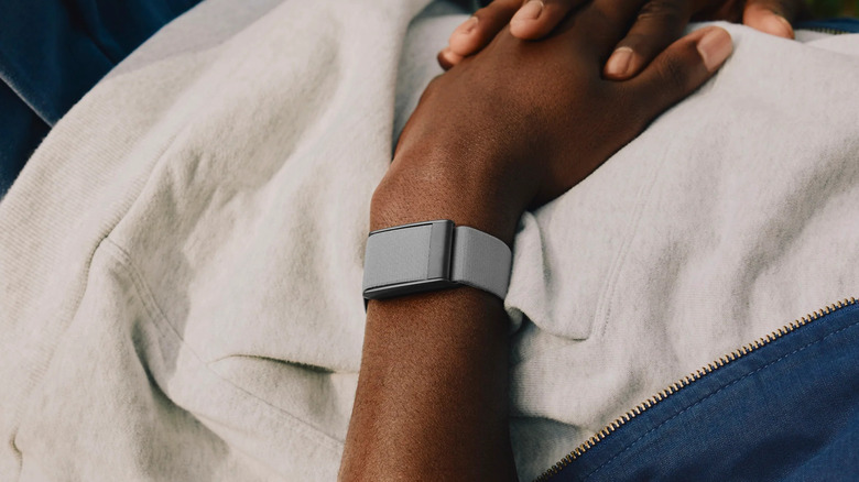 A person wearing the Whoop 5.0 band