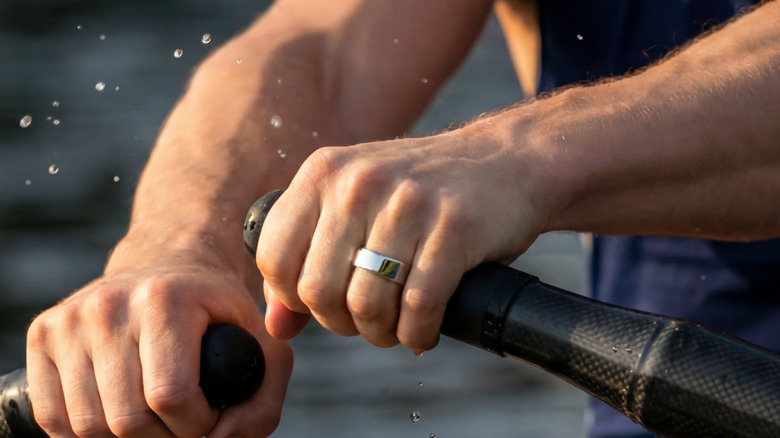 A person rowing wearing the Ultrahuman Ring Pro