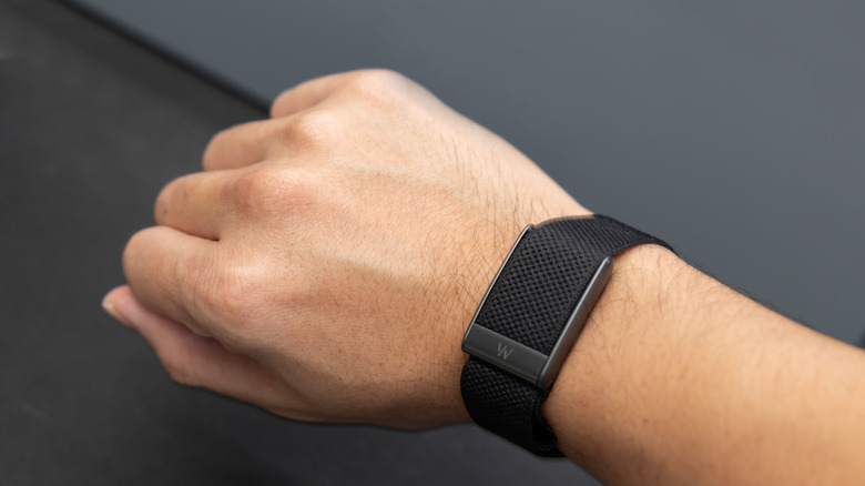 A person wearing the Whoop 5.0 band