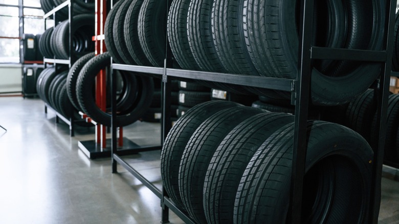 vehicle tires lined up on storage racks