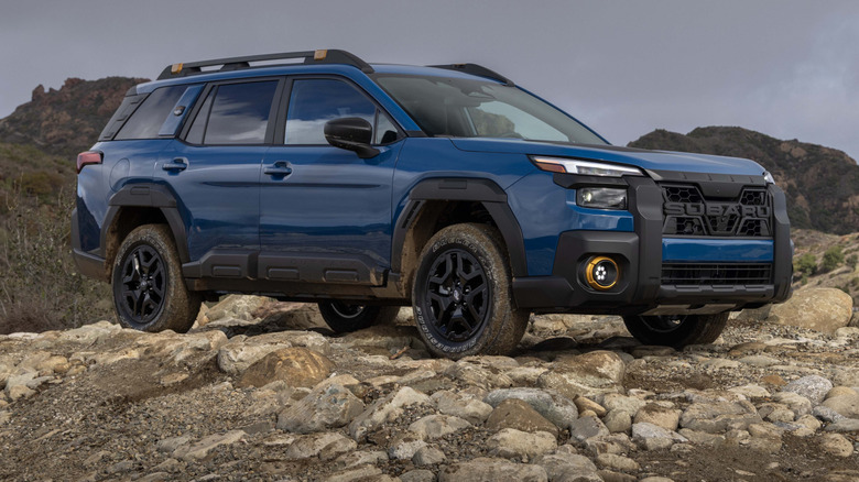 Front 3/4 view of Subaru Outback Wilderness in rocky, mountainous setting