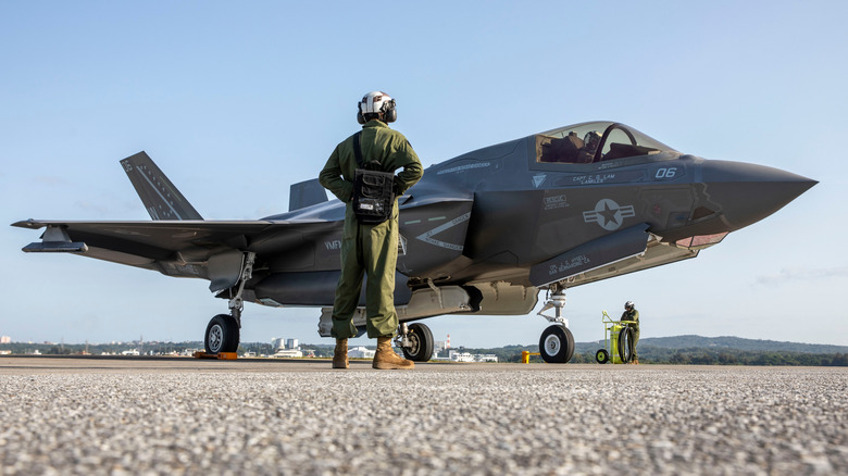 Man standing in front of F35 Lightning II on tarmac