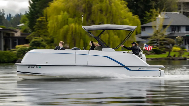 people riding in pure watercraft pontoon