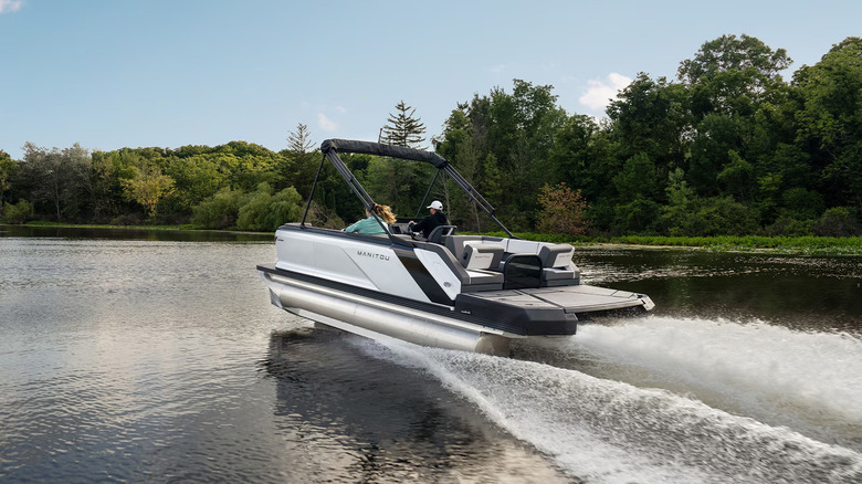 couple riding in manitou cruise pontoon