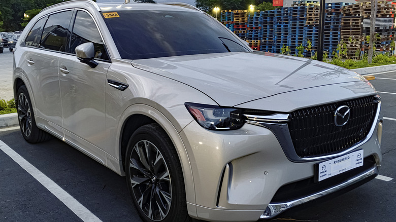 Mazda CX-90 parked on in a seller's parking lot