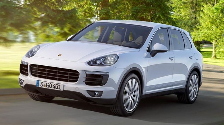 White first-gen Porsche Cayenne front 3/4
