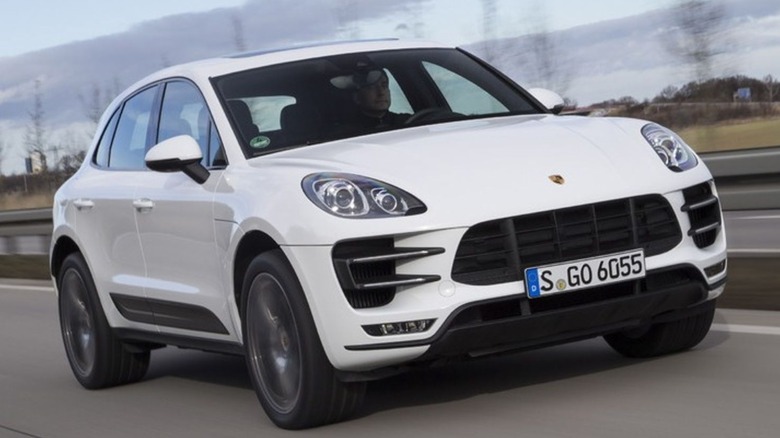 2015 Porsche Macan driving on a road