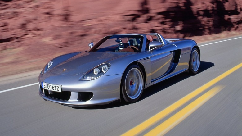 Porsche Carrera GT driving on a road
