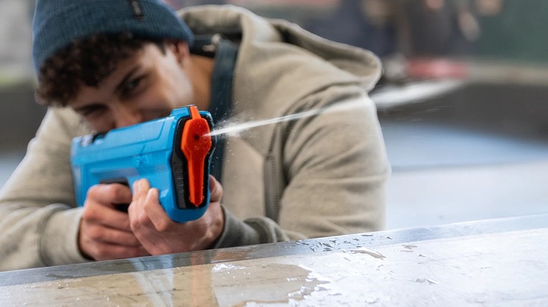 Person using SpyraGO water gun