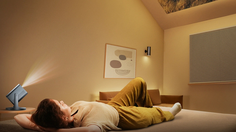 Person using Hisense C2 projector