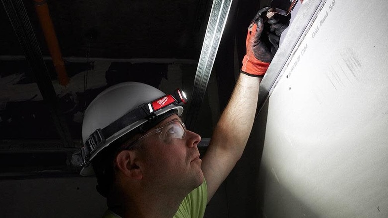 Redlithium USB 600-lumen Low-Profile Headlamp attached to hard hat and in use
