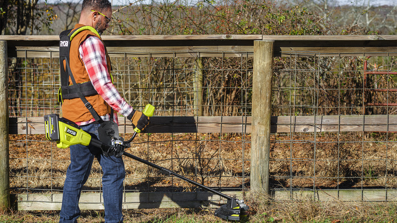 Person Ryobi 40V String Trimmer