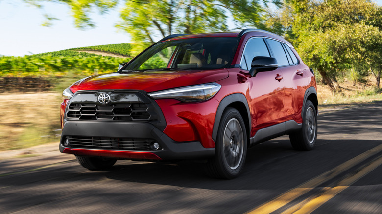 A red 2026 Toyota Corolla Cross on the road