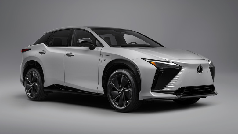 A white 2026 Lexus RZ 550e against a white studio background