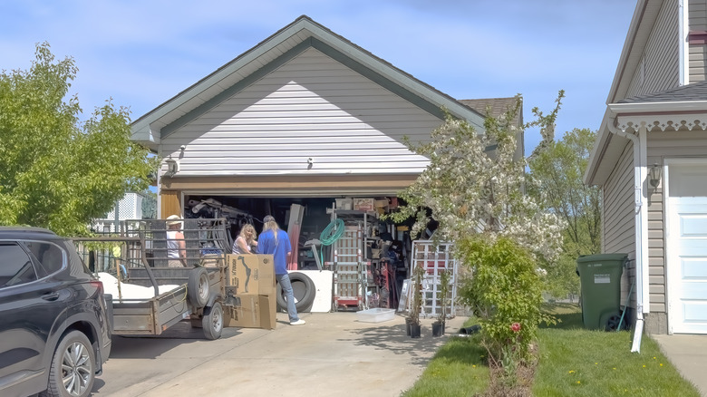 A homeowner hosting a yard sale in their garage
