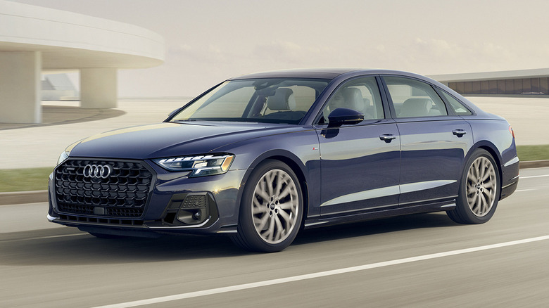 navy 2026 Audi A8 driving down a street