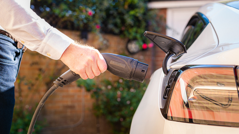 Plugging in charger EV