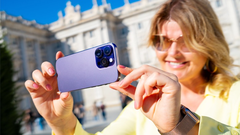 woman recording with iPhone