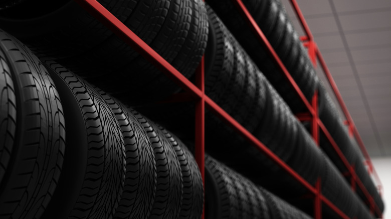 Dozens of new tires sitting on shelf in store