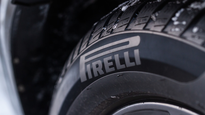 Pirelli tire close-up with clumps of snow on top