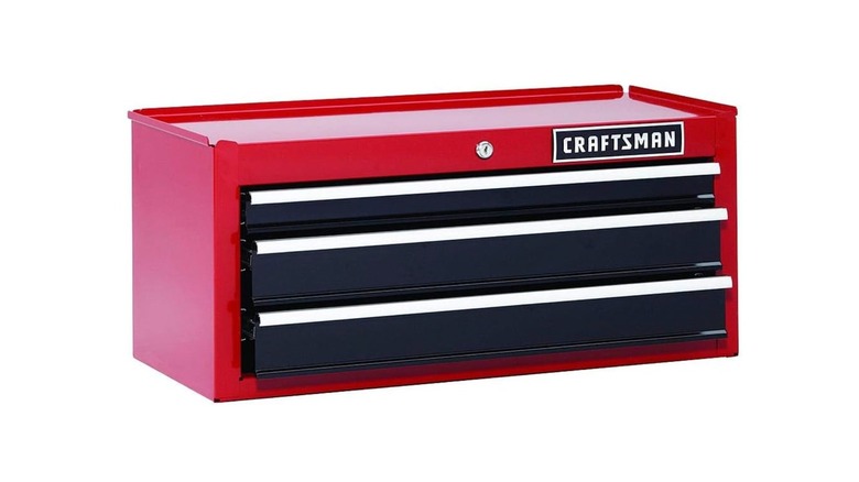 A 26" red and black rolling tool chest by Craftsman