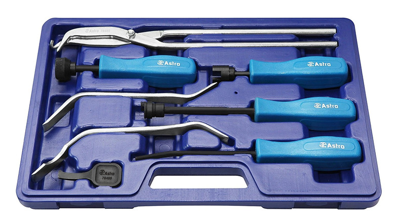 set of drum brake tools in a blue plastic tray