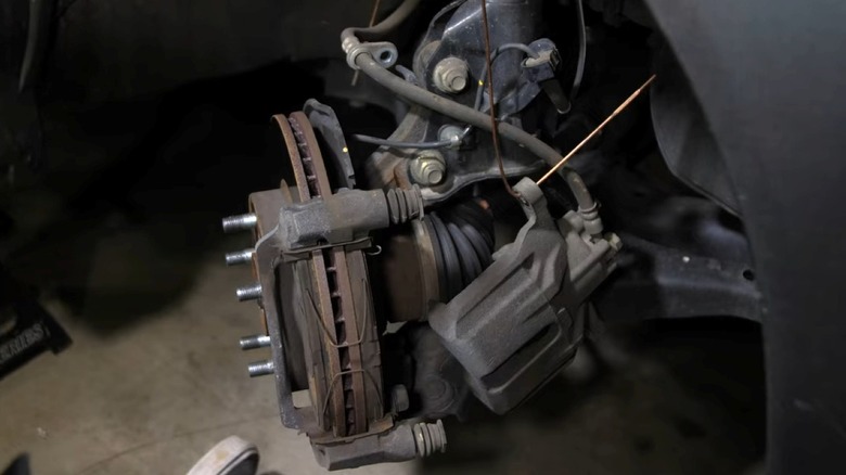 A vehicle's front brake assembly with caliper removed