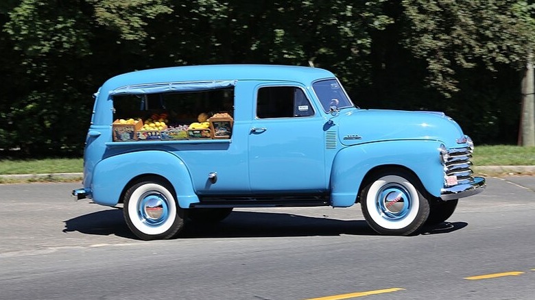 Blue 1953 Canopy Express vendor truck on roadside