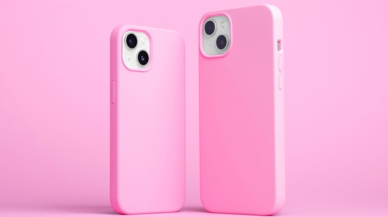 Two iPhones in pink cases