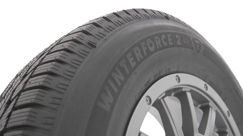 A Firestone Winterforce 2 tire on display